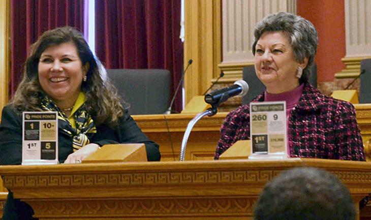 Tanya Kelly-Bowry, left, and Norma Anderson speak to CU Advocates who gathered Friday at the Capitol