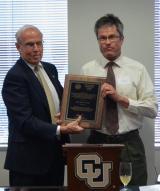 John Harner, UCCS, receives the Thomas Jefferson Award from CU President Bruce Benson.