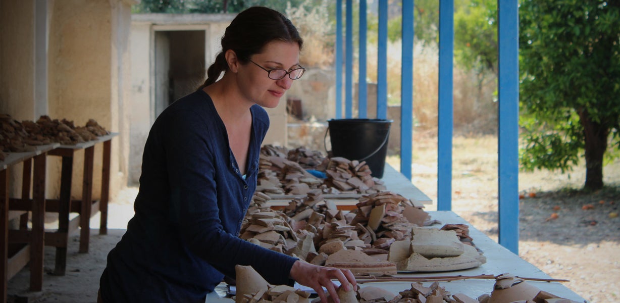 Sarah James at work on pottery at Corinth.