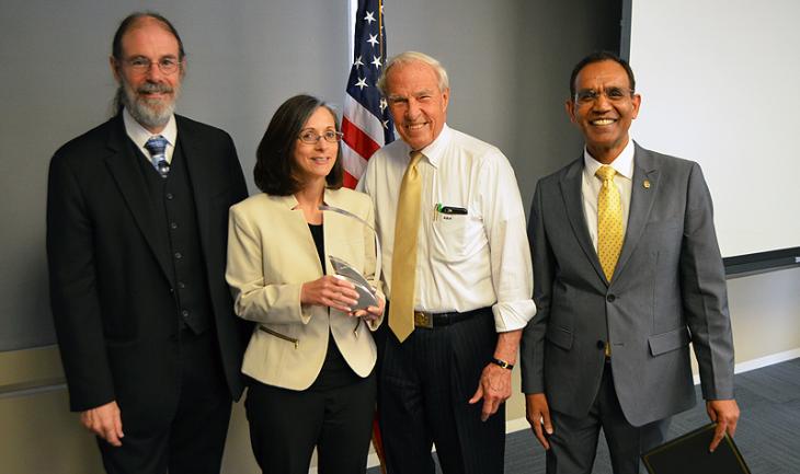 Vice President of Academic Affairs Michael Lightner, left, Jill Taylor, President Bruce Benson and Faculty Council Chair Ravinder Singh. Taylor received the council's Administrator of the Year Award.