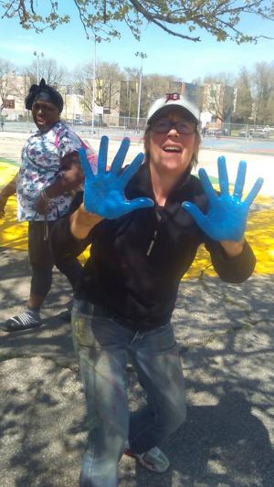 Lois Brink plays with paint earlier this month at Duckrey School in Philadelphia.