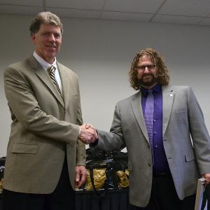 Arnold (right) receiving award from Leonard Dinegar, vice president for administration