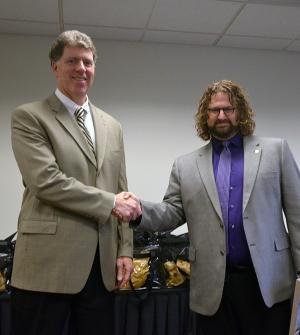 Vice President Leonard Dinegar present Arnold with the 2015 President's Employee of the Year