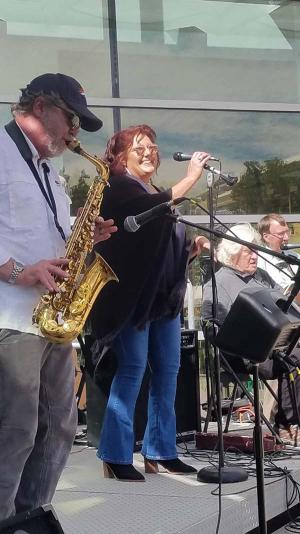 Mary Coussons-Read singing with the UCCS Physics Classic Rock and Roll Orchestra earlier this month at a Colorado Springs Cool Science Festival event. Karaoke is a favorite pastime, too, she said.