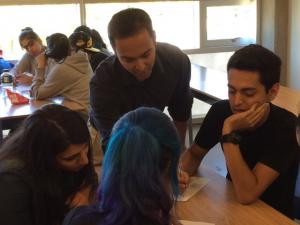 Rajiv Jhangiani with students in the classroom.
