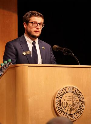 Kroll speaking at the 2017 Veterans Day Ceremony at CU Boulder.