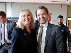 Board of Regents Vice Chair Sue Sharkey congratulates President Todd Saliman.