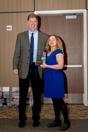 Leonard Dinegar, vice president and chief of staff, with award-winner Melanie Sidwell.