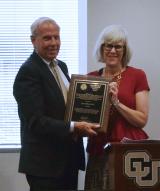 Julia Willis, CU Boulder, receives the Thomas Jefferson Award from CU President Bruce Benson.