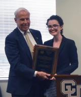 Lígia Batista Silverman, CU Boulder, receives the Thomas Jefferson Award from CU President Bruce Benson.