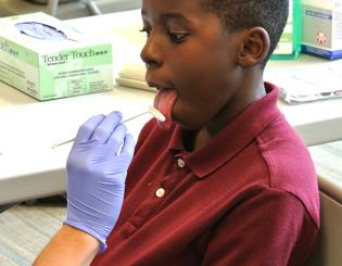 Dental medicine students and faculty provide free screenings at Boys &amp; Girls Club
