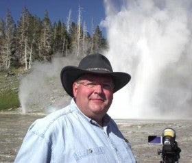 While vacationing, Faculty Council Chair Mark Malone keeps an HD video camera handy for explorations  at such national parks as Yellowstone, with its Riverside Geyser. 